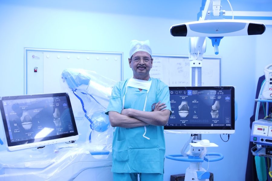 Dr. R. K. Singh during robotic knee replacement surgery, Globus Hospital operation theatre