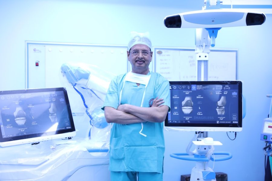 Dr. R. K. Singh during robotic knee replacement surgery, Globus Hospital operation theatre