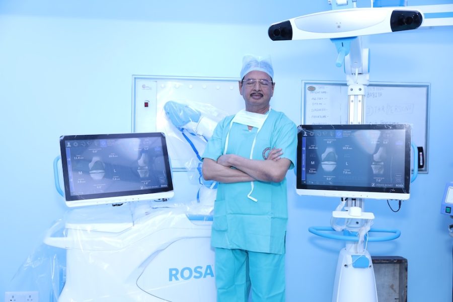 Dr. R. K. Singh during robotic knee replacement surgery, Globus Hospital operation theatre