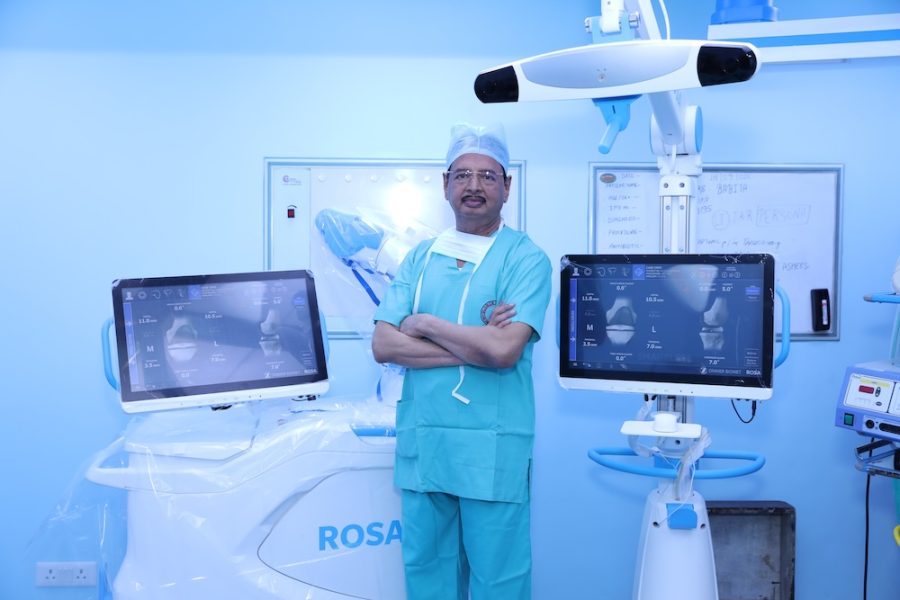 Dr. R. K. Singh during robotic knee replacement surgery, Globus Hospital operation theatre